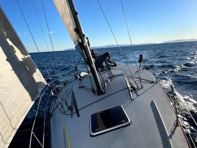 Slide: The Image of Sailing on a 1985 Farr PERFORMANCE yacht in open sea under clear blue skies. - 33