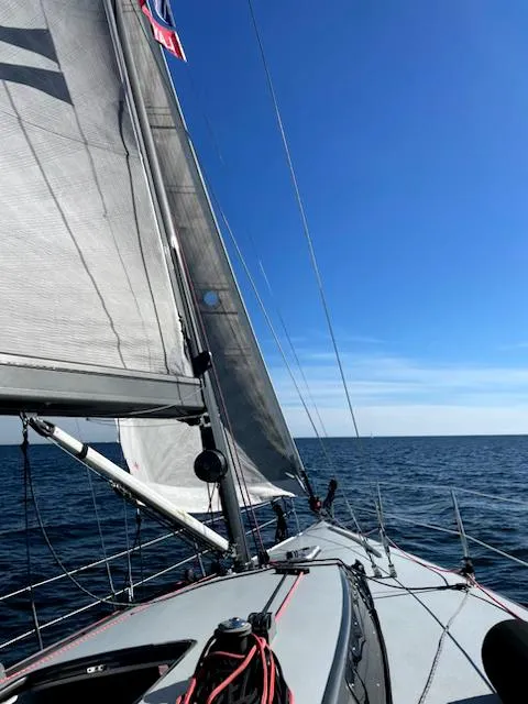 Slide: The Image of Sailing on a 1985 Farr PERFORMANCE yacht under clear blue skies. - 34