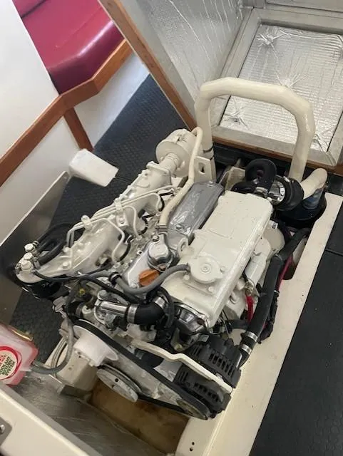 Slide: The Image of 1985 Farr PERFORMANCE engine in a boat interior, showcasing mechanical components and design. - 36