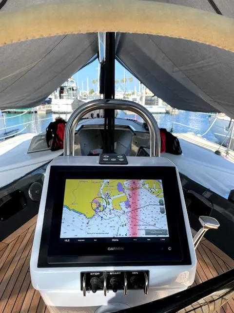 Slide: The Image of Cockpit of 1985 Farr PERFORMANCE sailboat with Garmin navigation display, docked at marina. - 5