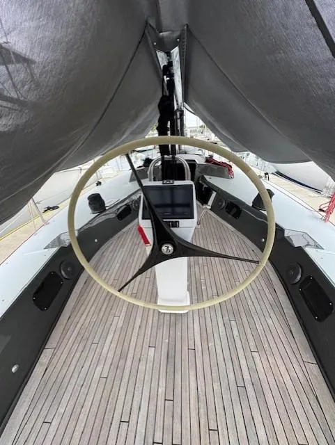 Slide: The Image of 1985 Farr PERFORMANCE yacht cockpit with wooden deck and modern steering wheel. - 6