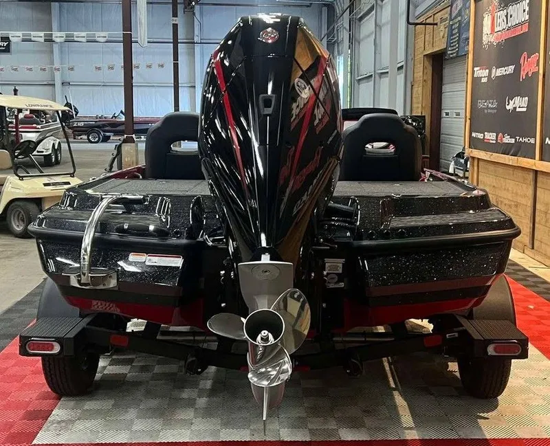 Slide: The Image of 2025 Nitro Z20 XL Pro boat with powerful outboard motor in showroom setting. - 3