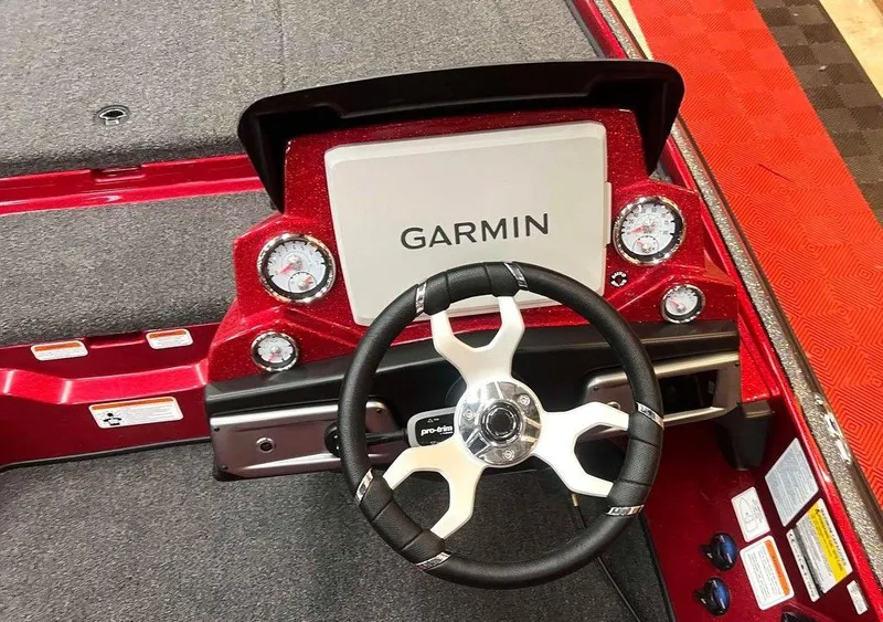 Slide: The Image of 2025 Nitro Z20 XL Pro boat dashboard with Garmin display and steering wheel. - 4