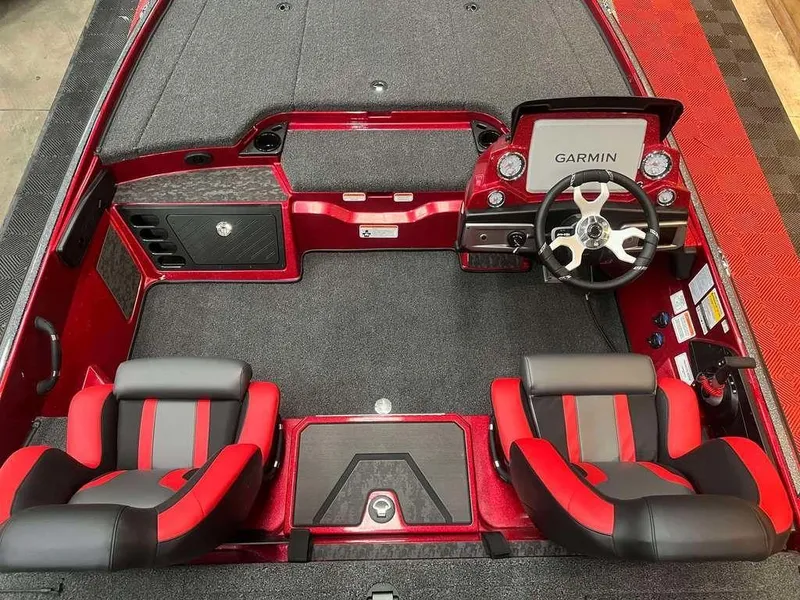 Slide: The Image of 2025 Nitro Z20 XL Pro boat interior with red and black seats, Garmin dashboard. - 6