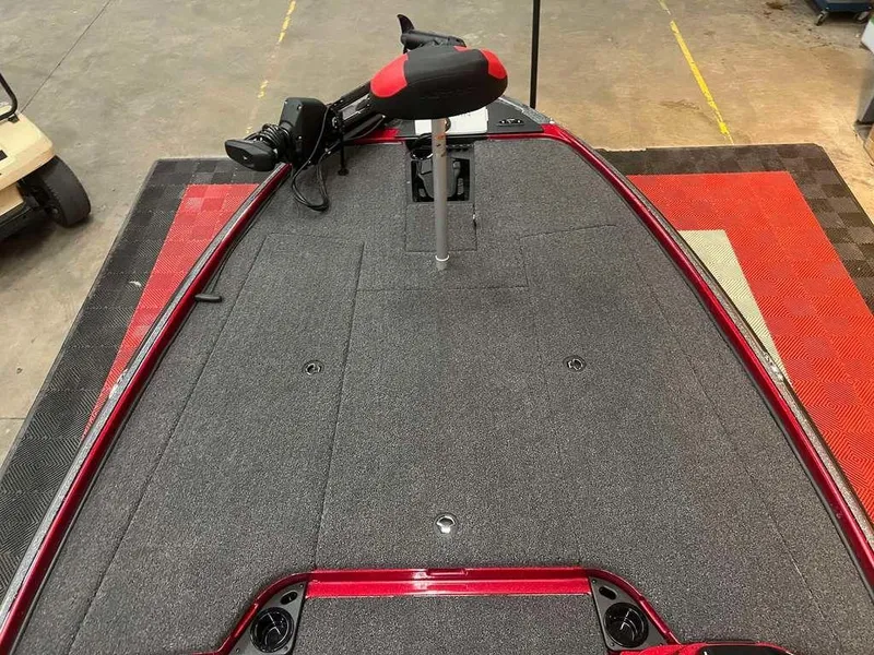 Slide: The Image of 2025 Nitro Z20 XL Pro boat deck with trolling motor, red and gray design. - 7