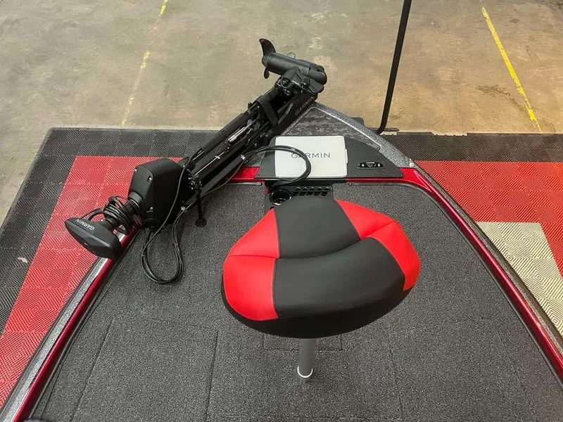 Slide: The Image of 2025 Nitro Z20 XL Pro boat deck with red and black seat and Garmin equipment. - 8