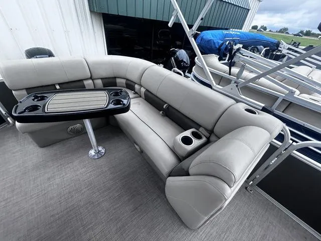 Slide: The Image of 2022 Sun Tracker PARTY BARGE® 20 DLX with spacious seating and table setup. - 14