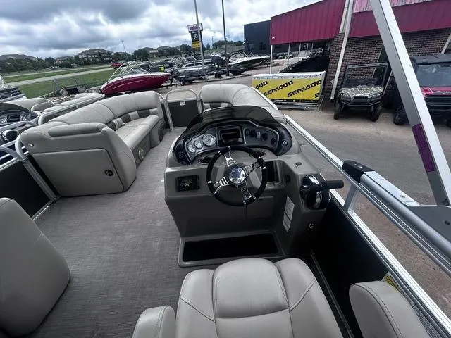 Slide: The Image of 2022 Sun Tracker PARTY BARGE® 20 DLX interior with steering console and seating. - 17
