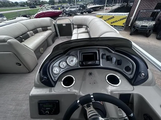 Slide: The Image of 2022 Sun Tracker PARTY BARGE® 20 DLX interior with dashboard and seating area. - 18