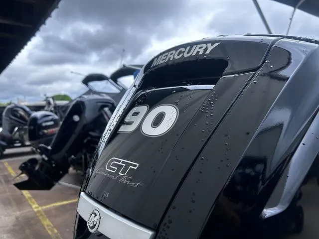 Slide: The Image of Mercury 90 CT outboard motor on 2022 Sun Tracker PARTY BARGE® 20 DLX, under cloudy sky. - 6