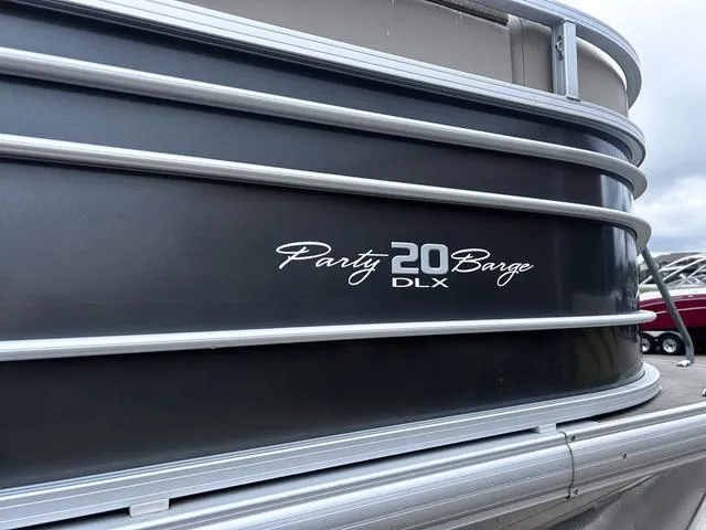 Slide: The Image of 2022 Sun Tracker PARTY BARGE® 20 DLX pontoon boat, side view with logo. - 7