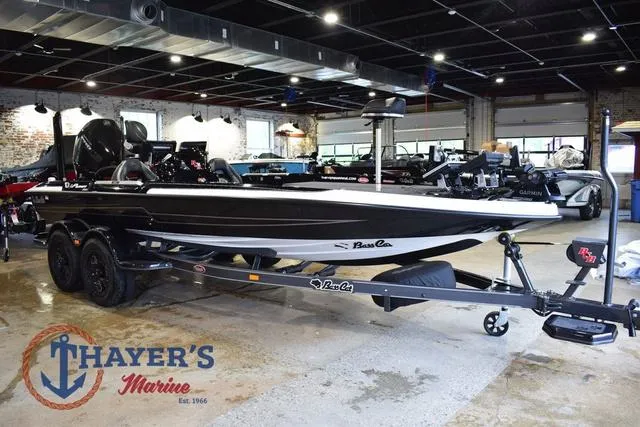 Slide: The Image of 2023 Bass Cat Puma STS boat displayed at Thayer's Marine showroom. - 1