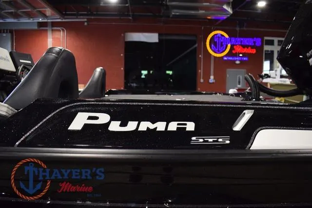 Slide: The Image of 2023 Bass Cat Puma STS boat at Thayer's Marine showroom. - 13