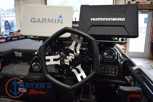 Slide: The Image of 2023 Bass Cat Puma STS dashboard with Garmin and Humminbird displays at Thayer's Marine. - 21
