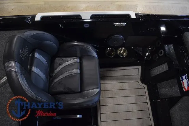 Slide: The Image of 2023 Bass Cat Puma STS boat interior with black seating and Thayer's Marine logo. - 23