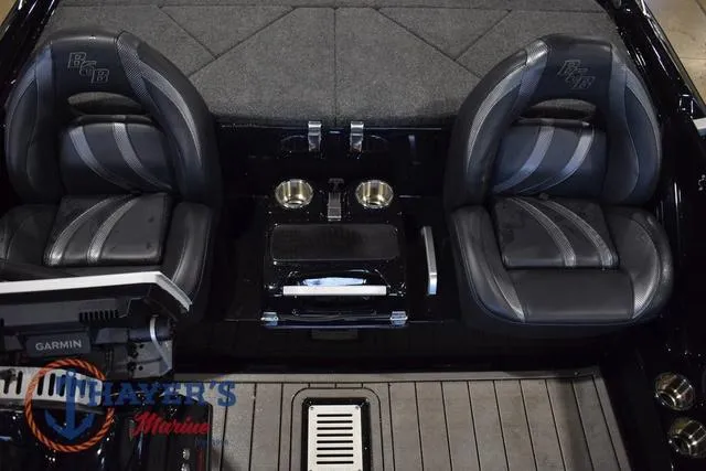 Slide: The Image of 2023 Bass Cat Puma STS interior with dual seats and Garmin equipment. - 24