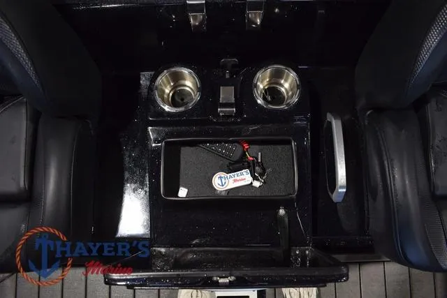 Slide: The Image of 2023 Bass Cat Puma STS boat console with cup holders and storage compartment. - 25