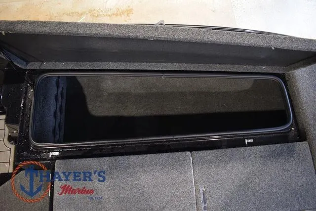 Slide: The Image of 2023 Bass Cat Puma STS storage compartment with Thayer's Marine logo. - 30