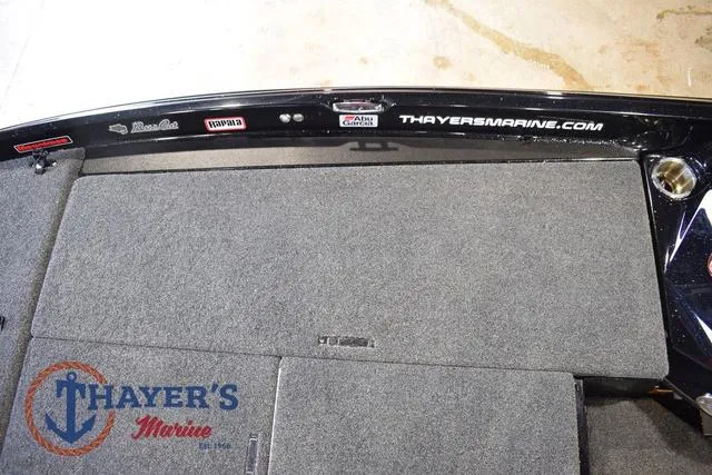 Slide: The Image of 2023 Bass Cat Puma STS boat deck with Thayer's Marine branding. - 31