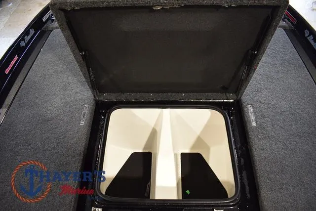 Slide: The Image of 2023 Bass Cat Puma STS storage compartment with open lid, showcasing interior space. - 34