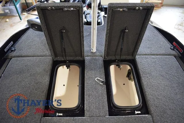 Slide: The Image of 2023 Bass Cat Puma STS boat storage compartments open, showcasing interior space. - 35