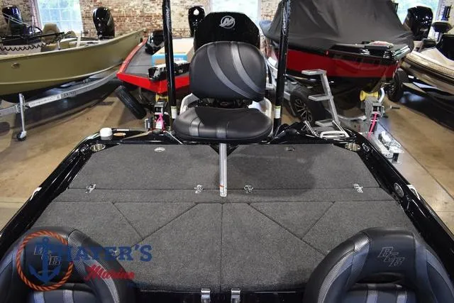 Slide: The Image of 2023 Bass Cat Puma STS boat interior with seating and storage compartments. - 41