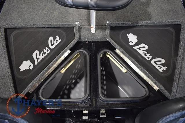 Slide: The Image of 2023 Bass Cat Puma STS boat storage compartments with logo, featuring Thayer's Marine branding. - 42