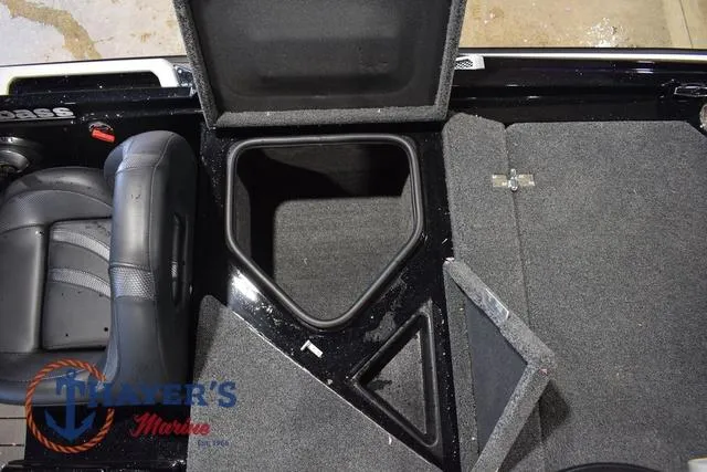 Slide: The Image of 2023 Bass Cat Puma STS boat interior with open storage compartments and seating. - 44