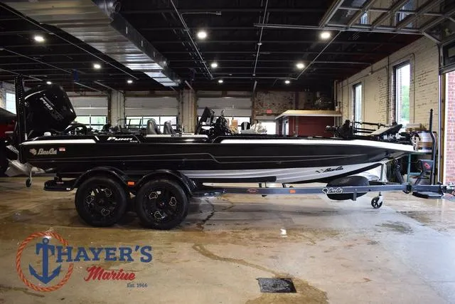Slide: The Image of 2023 Bass Cat Puma STS boat in showroom at Thayer's Marine. - 6