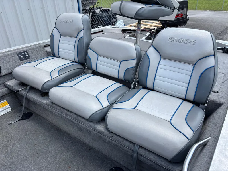 Slide: The Image of 1995 Bass Tracker Pro 18 boat seats, gray with blue accents, in excellent condition. - 7