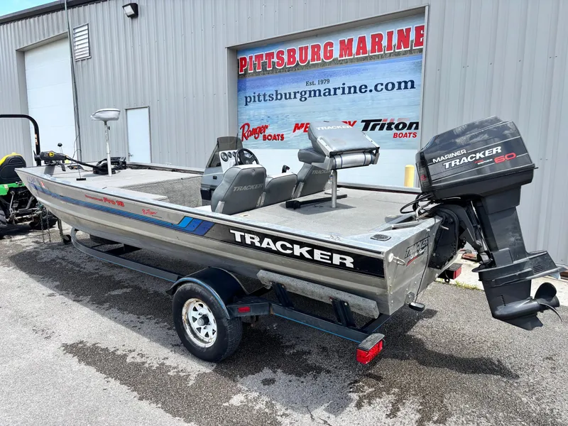 Slide: The Image of 1995 Bass Tracker Pro 18 boat on trailer at Pittsburg Marine dealership. - 9
