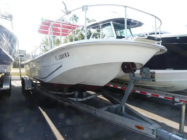 Slide: The Image of 2012 Carolina Skiff DLV Series 258 boat on trailer, parked outdoors. - 1