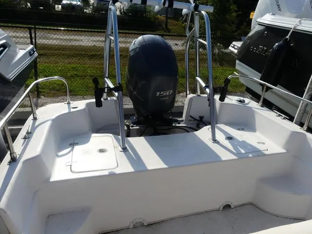 Slide: The Image of 2012 Carolina Skiff DLV Series 258 boat with 150 HP outboard motor. - 10