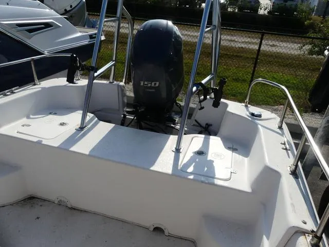 Slide: The Image of 2012 Carolina Skiff DLV Series 258 boat with 150 HP outboard motor. - 16