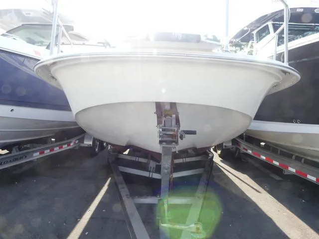 Slide: The Image of 2012 Carolina Skiff DLV Series 258 boat on trailer, front view in sunlight. - 2