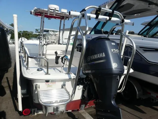 Slide: The Image of 2012 Carolina Skiff DLV Series 258 with Yamaha 150 engine, docked in marina. - 4