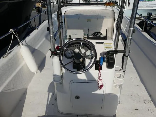 Slide: The Image of 2012 Carolina Skiff DLV Series 258 boat console with steering wheel and controls. - 7