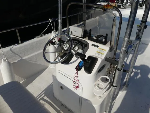Slide: The Image of 2012 Carolina Skiff DLV Series 258 boat console with steering wheel and controls. - 8