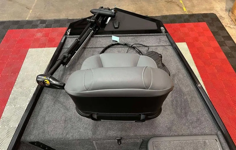 Slide: The Image of 2025 Tracker BASS TRACKER® Classic XL boat interior with gray seat and trolling motor. - 6