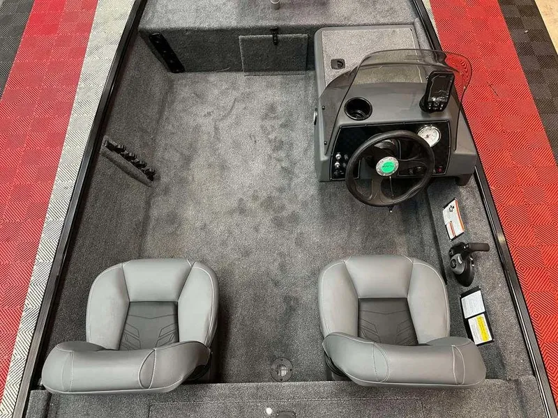 Slide: The Image of 2025 Tracker BASS TRACKER® Classic XL interior with dual seats and steering console. - 8