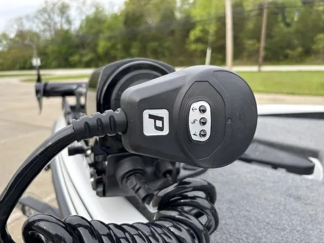 Slide: The Image of Close-up of a Phoenix 920 Elite 2020 boat control panel with coiled cable. - 13