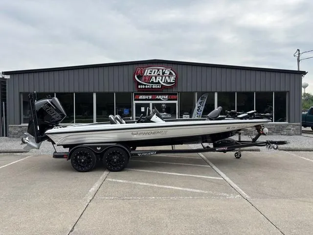 Slide: The Image of 2020 Phoenix 920 Elite boat parked outside Weda's Marine dealership. - 3