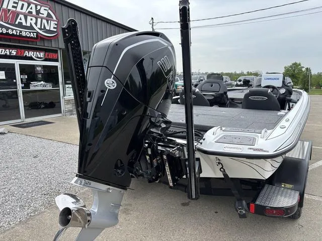 Slide: The Image of 2020 Phoenix 920 Elite boat with powerful outboard motor at dealership. - 5