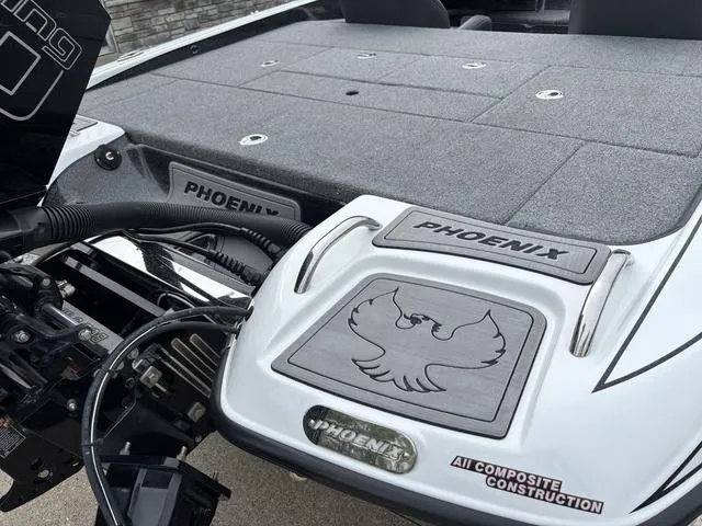 Slide: The Image of 2020 Phoenix 920 Elite boat deck with logo and composite construction details. - 7