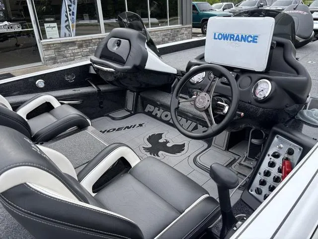 Slide: The Image of 2020 Phoenix 920 Elite boat interior with Lowrance navigation system and dual seating. - 9
