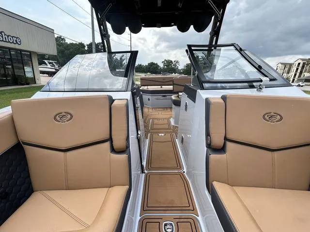 Slide: The Image of 2025 Cobalt R6 Surf boat interior with tan seating and sleek design. - 13