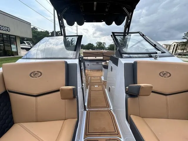 Slide: The Image of 2025 Cobalt R6 Surf boat interior with tan leather seats and sleek design. - 14