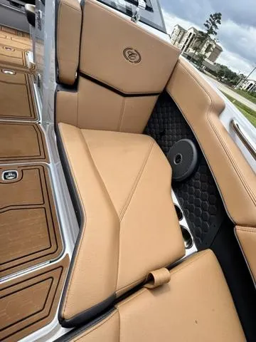 Slide: The Image of 2025 Cobalt R6 Surf boat interior with tan leather seating and modern design. - 17