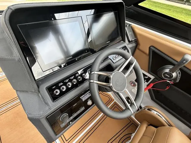 Slide: The Image of 2025 Cobalt R6 Surf dashboard with dual screens and modern steering wheel. - 24