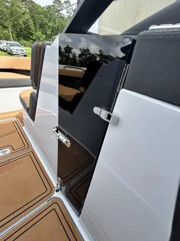 Slide: The Image of 2025 Cobalt R6 Surf boat interior with sleek seating and modern design. - 25